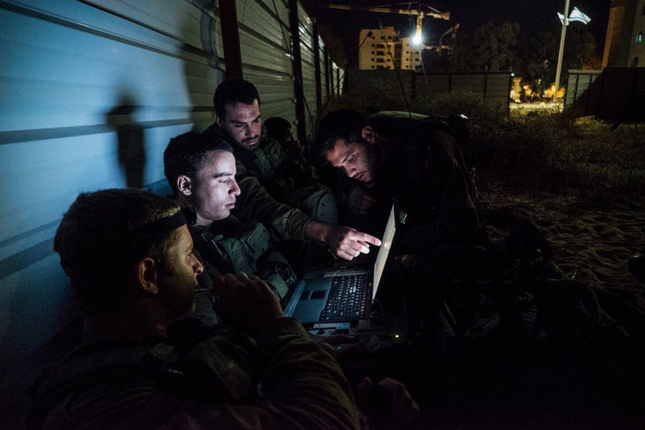 Artificial intelligence is being introduced at all levels of IDF decision-making. Pictured here, the Paratroopers Brigade during an exercise with other military units, including the elite canine unit Oketz. Credit: IDF via Flickr.