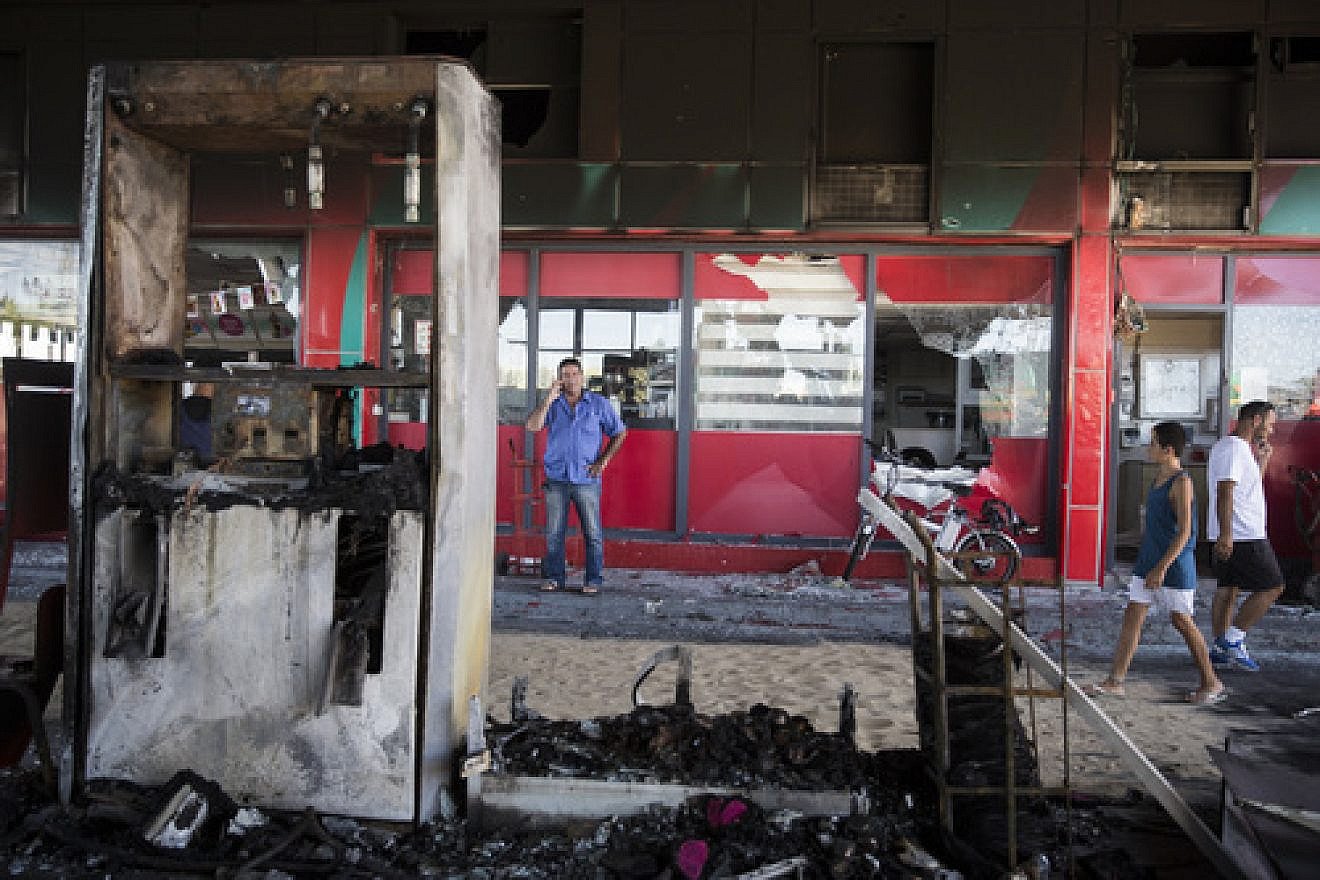 Click photo to download. The scene of a gas station in Ashdod that was hit directly by rocket fire from Gaza on the fourth day of Operation Protective Edge, July 11, 2014. The rocket caused explosions and three people were injured, one of them critically. Credit: Hadas Parush/Flash90.