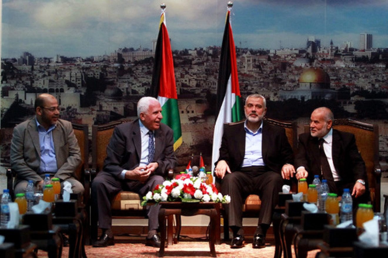 From left: Senior Hamas leader Moussa Abu Marzouk, senior Fatah official Azzam al-Ahmed, head of the Hamas government Ismail Haniyeh and deputy speaker of the Gaza-based Palestinian Parliament Ahmed Bahar attend a meting in Gaza City on April 22, 2014. Credit: Abed Rahim Khatib/Flash90.