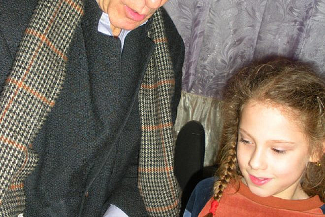 Click photo to download. Caption: In the Ukrainian city of Odessa, Lera Soroka-Krushelnitskaya, whose family receives JDC support, shares a story from her new book with JDC CEO Alan H. Gill. Credit: JDC.
