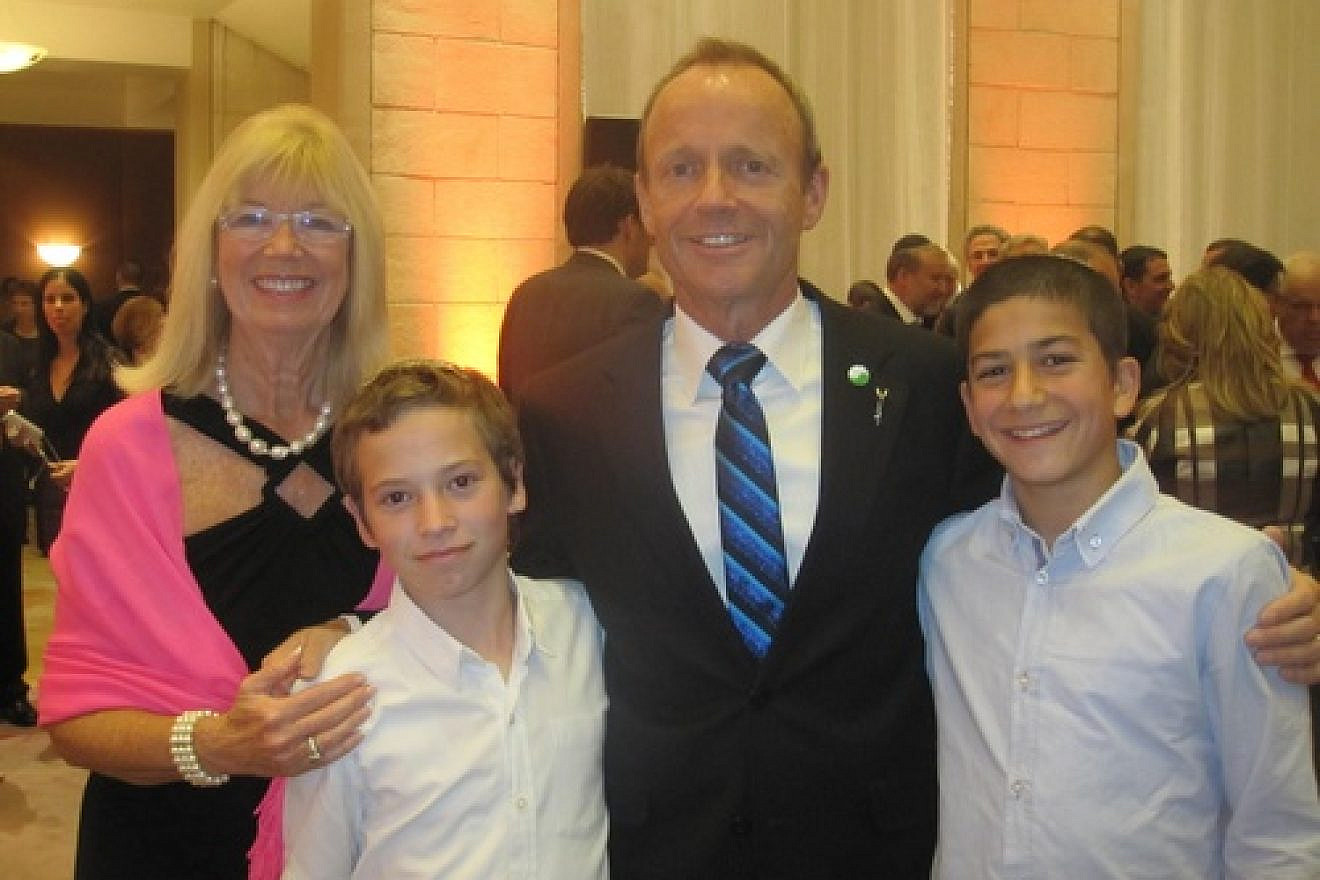 Click photo to download. Caption: Former Canadian cabinet minister Stockwell Day and his wife Valorie pictured with Israeli boys who each lost their fathers in a terrorist attack, at a state dinner during Canadian Prime Minister Stephen Harper's recent trip to Israel. Credit: Provided photo.