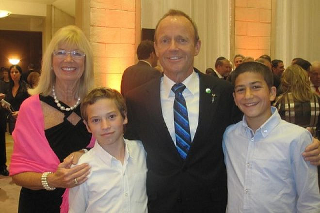 Click photo to download. Caption: Former Canadian cabinet minister Stockwell Day and his wife Valorie pictured with Israeli boys who each lost their fathers in a terrorist attack, at a state dinner during Canadian Prime Minister Stephen Harper's recent trip to Israel. Credit: Provided photo.