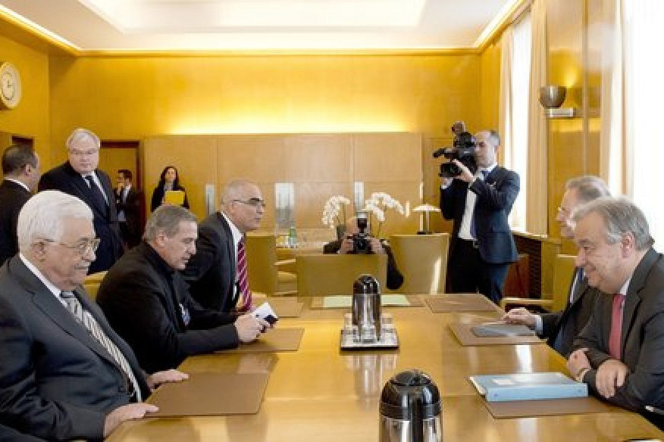 Palestinian Authority leader Mahmoud Abbas (in front, at left) sits across the table from U.N. Secretary-General António Guterres in Geneva on Feb. 27, 2017. Credit: U.N. Photo/Jean-Marc Ferré.