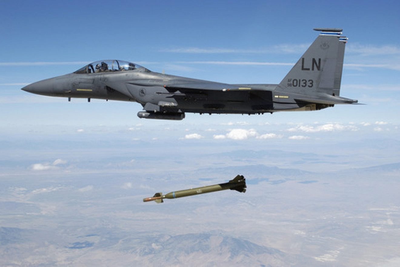 A U.S. Air Force F-15E Strike Eagle aircraft releases a GBU-28 ”bunker buster” 5,000-pound laser-guided bomb over the Utah Test and Training Range. Credit: TSGT Michael Ammons, USAF via Wikimedia Commons.