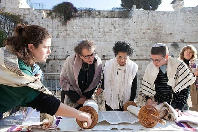 Click photo to download. Caption: Women of the Wall reading from the Torah at Robinson's Arch. Credit: Women of the Wall.
