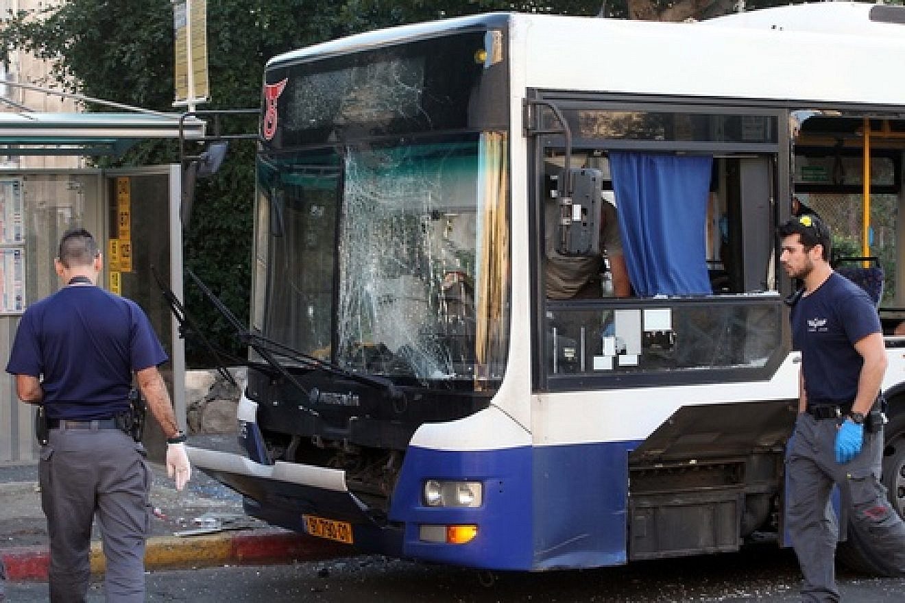 Israeli police and rescue personnel at the scene of an explosion on a passenger bus in Bat Yam, near Tel Aviv, on Dec. 22, 2013. The bomb was part of a recent upsurge in Palestinian terrorism that runs parallel to Israel-Palestinian conflict negotiations. Credit: Gideon Markowicz/Flash90.