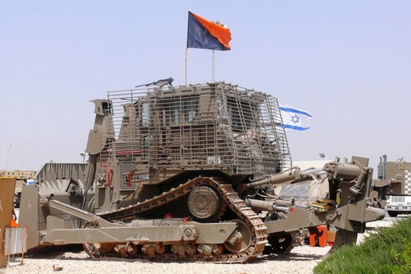 An IDF Caterpillar D9. At its 2014 General Assembly, Presbyterian Church USA targeted Caterpillar for its resolution to divest from Israel because Israel allegedly “weaponizes” Caterpillar tractors—a misnomer for the fact that Israel puts armor on them to protect operators from IEDs (improvised explosive devices) and other attacks—and because its tractors are used to build the West Bank security fence, write Roberta P. Seid and Roz Rothstein. Credit: MathKnight via Wikimedia Commons.
