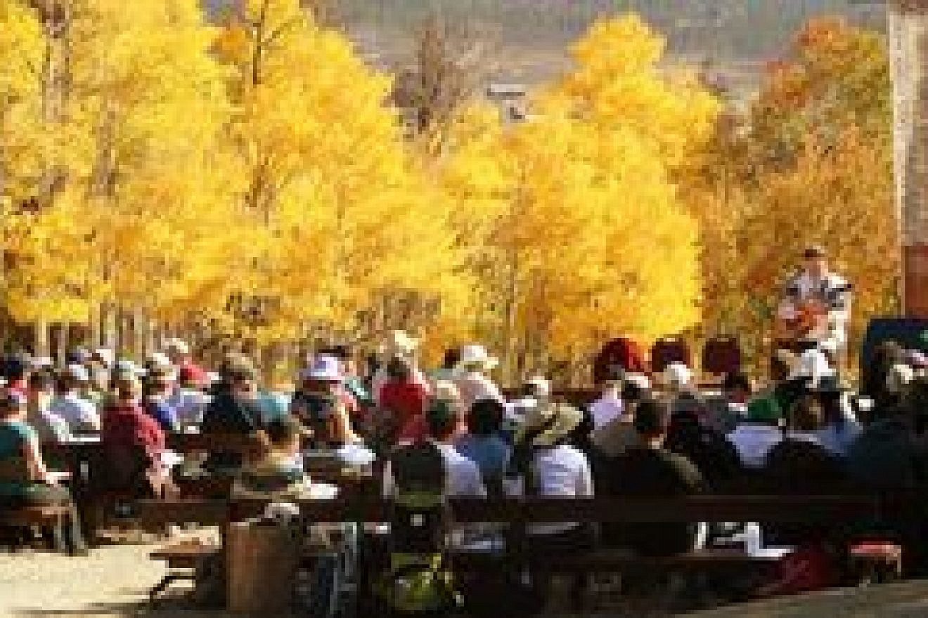 Click photo to download. A few lucky congregants get to bring in the new year in the Colorado forest. Credit: Adventure Rabbi.