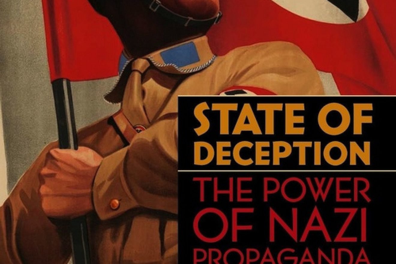 The book cover of "State of Deception: The Power of Nazi Propaganda," written by U.S. Holocaust Memorial Museum curators Steven Luckert and Susan Bachrach. The cover image is from a poster for the 1933 film "S.A.-Mann Brand." Credit: Kunstbibliothek Berlin/BPK, Berlin/Art Resource, New York.