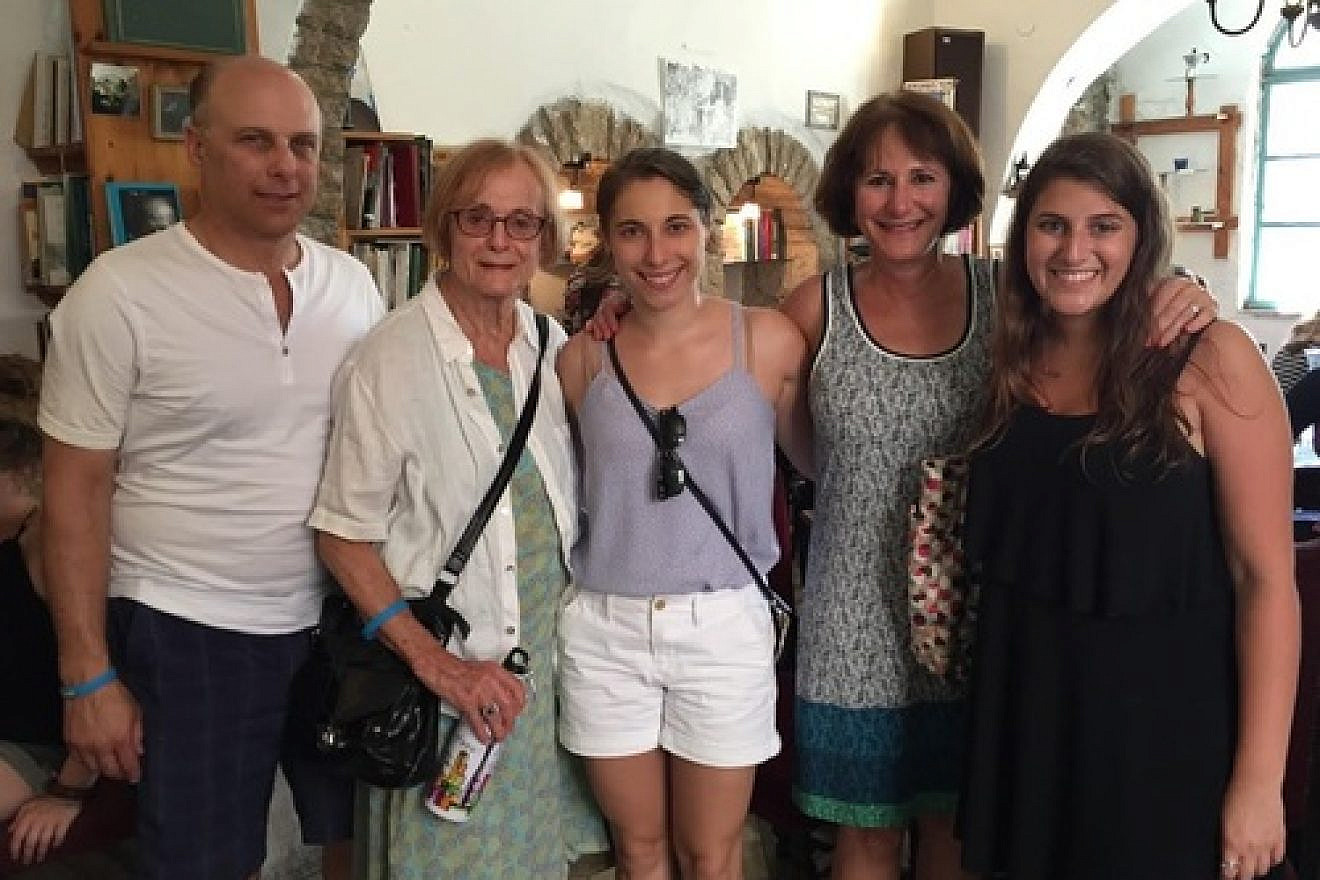 Click photo to download. Caption: In Israel, Eliana Rudee (center) is pictured with her father (far left), grandmother, mother, and a friend who also made aliyah. Credit: Christa Lilly.