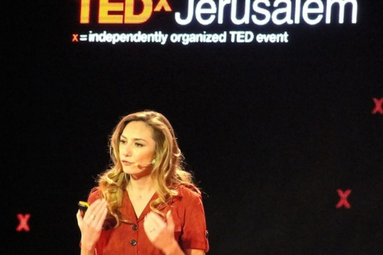 Click photo to download. Caption: Michal Ansky, a food journalist and television presenter, speaks at the Dec. 10 TEDx conference in Jerusalem. Credit: Judy Lash Balint.