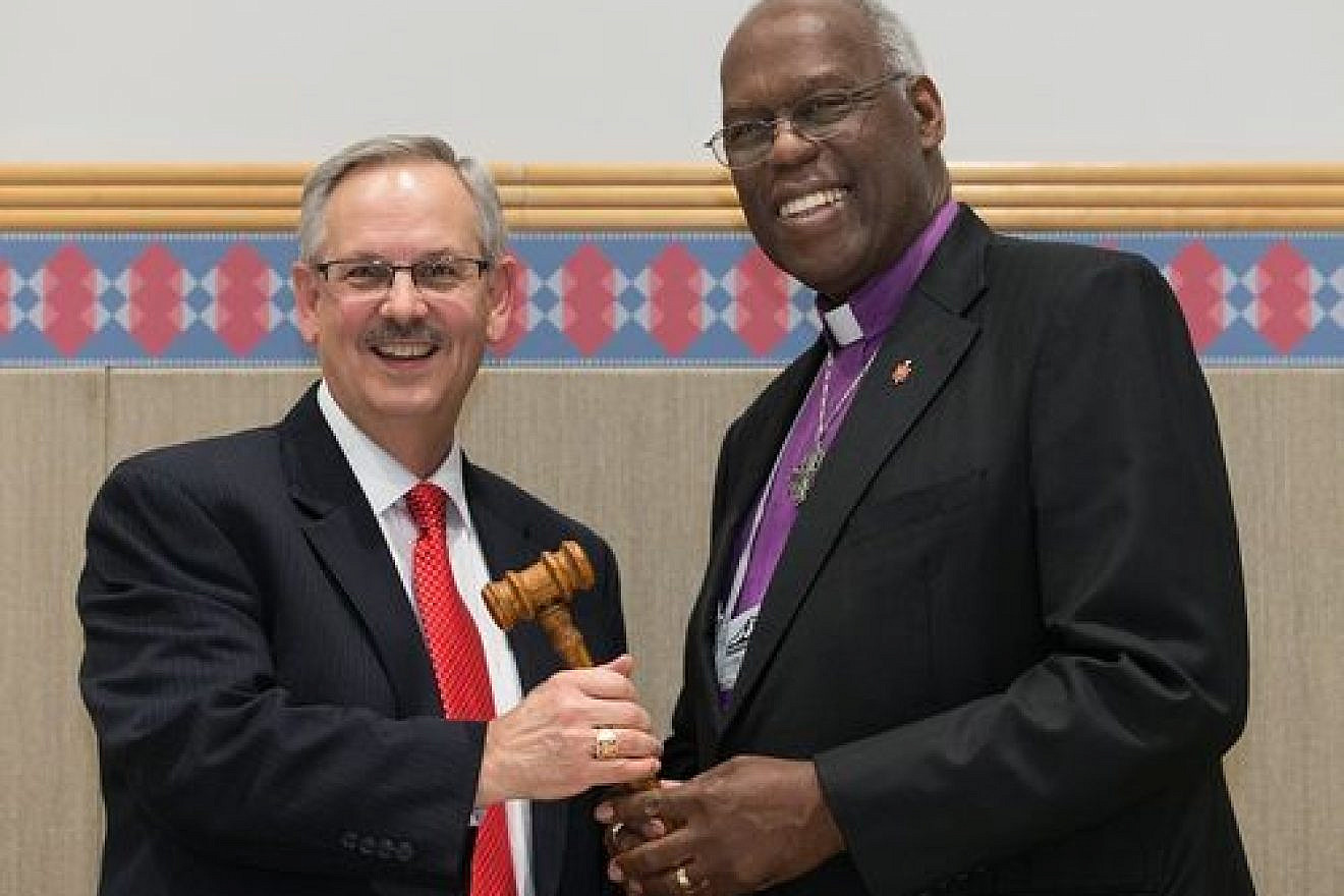 Click photo to download. Caption: The ceremonial passing of the gavel from outgoing United Methodist Church (UMC) Council of Bishops president Bishop Warner H. Brown, Jr. (at right) to the council's new president, Bishop Bruce R. Ought, during the UMC's quadrennial general conference in Portland, Ore., in May 2016. Credit: Mike DuBose/United Methodist News Service via Facebook.