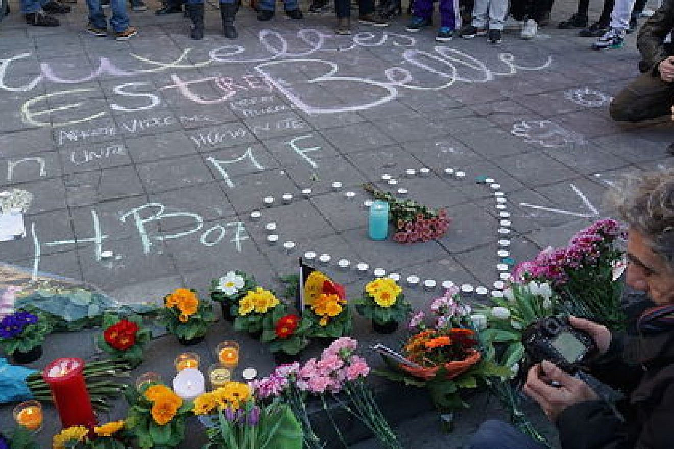 Click photo to download. Caption: A memorial in Brussels for the victims of the March 22 terror attacks in that city. Credit: Miguel Discart via Wikimedia Commons.