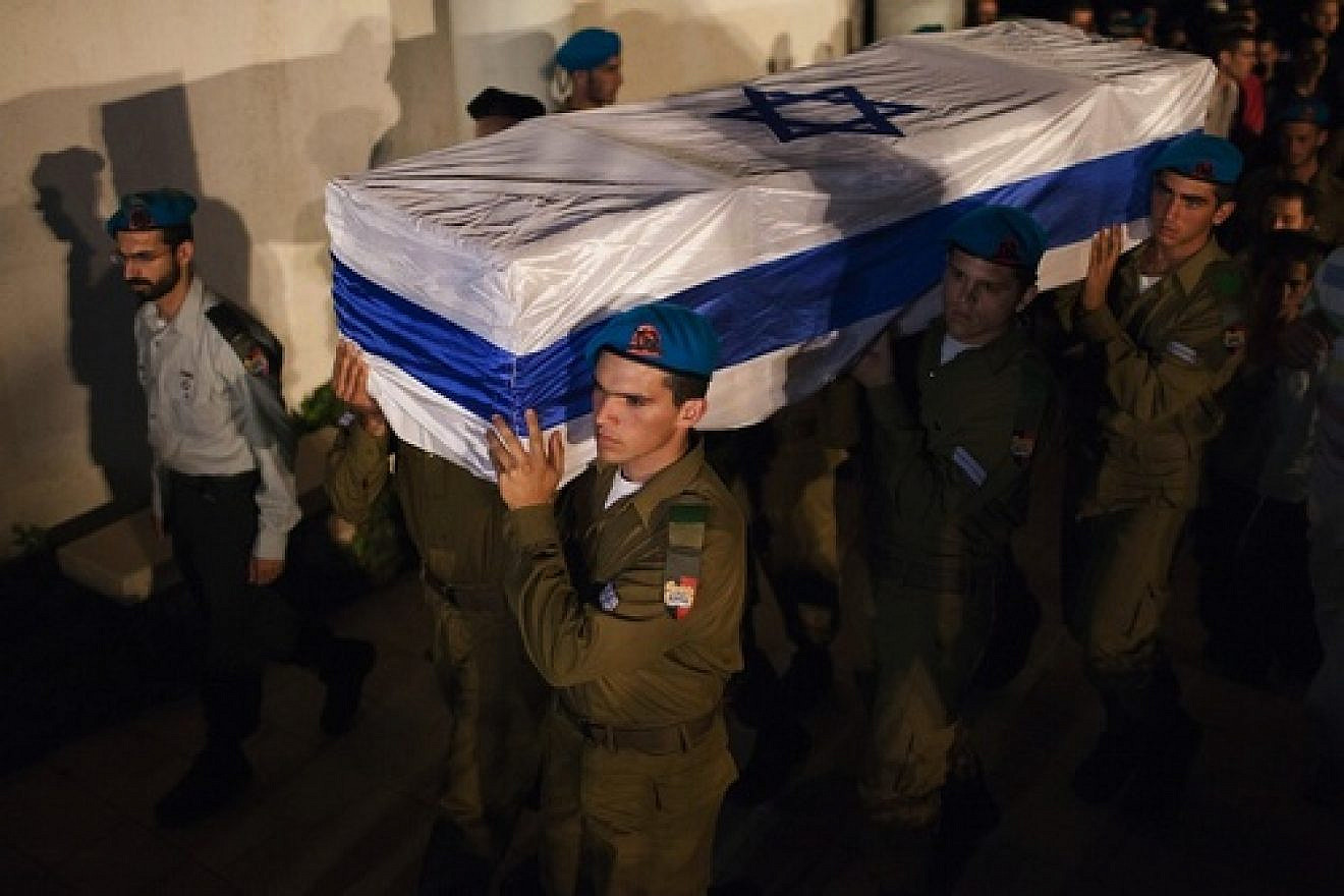 Click photo to download. Caption: Israeli soldiers carry the coffin of Netanel Yahalomi during his funeral in the Israeli city of Modiin, early Sunday, September 23, 2012. Yahalomi was killed September 21 in a shootout between Islamic terrorists and Israeli troops along Israel's southern border with Egypt. The Israeli troops returned fire, killing the terrorists. Credit: Yonatan Sindel/Flash90.
