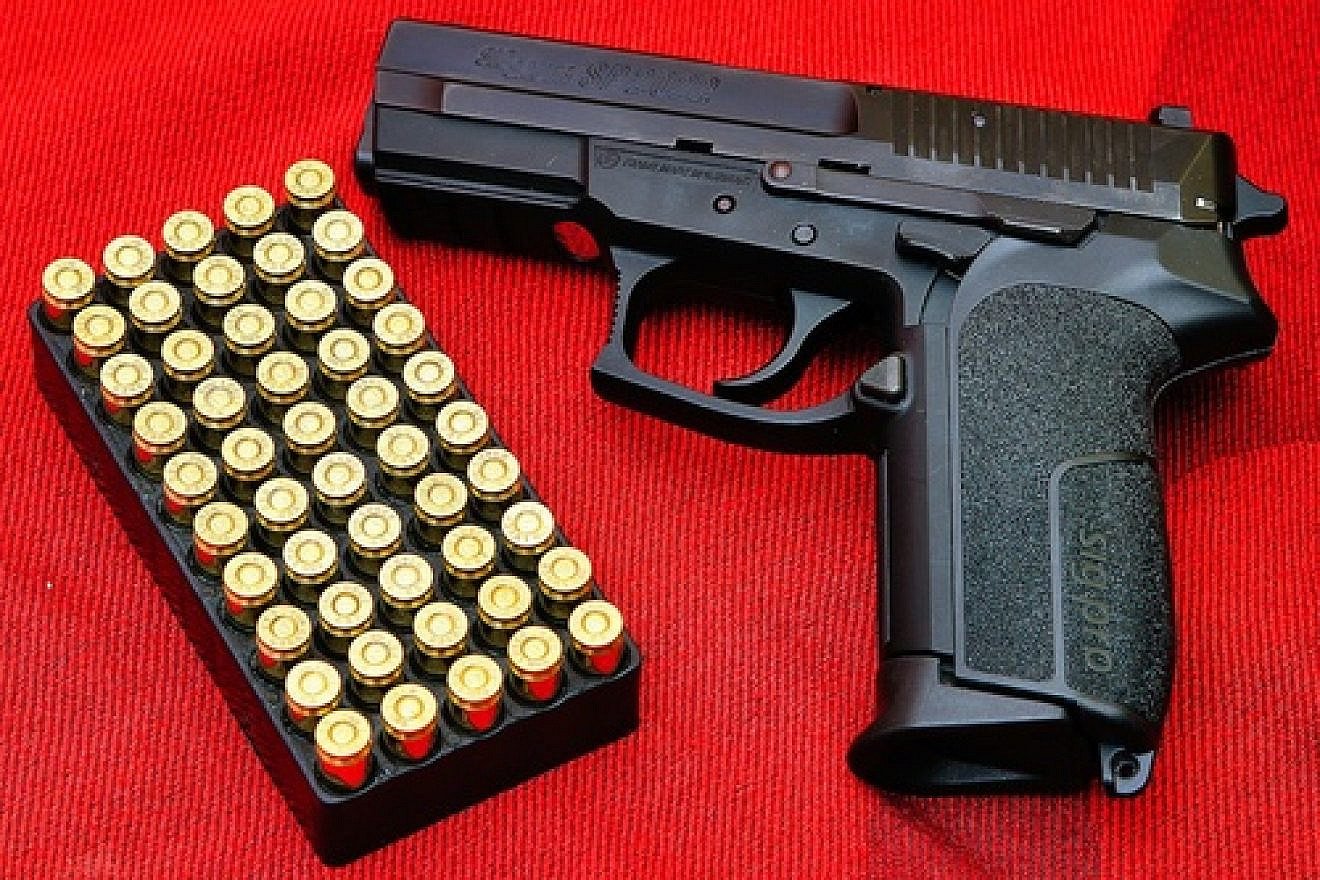 Click photo to download. Caption: An SIG Pro semi-automatic pistol. Credit: Augustas Didžgalvis.