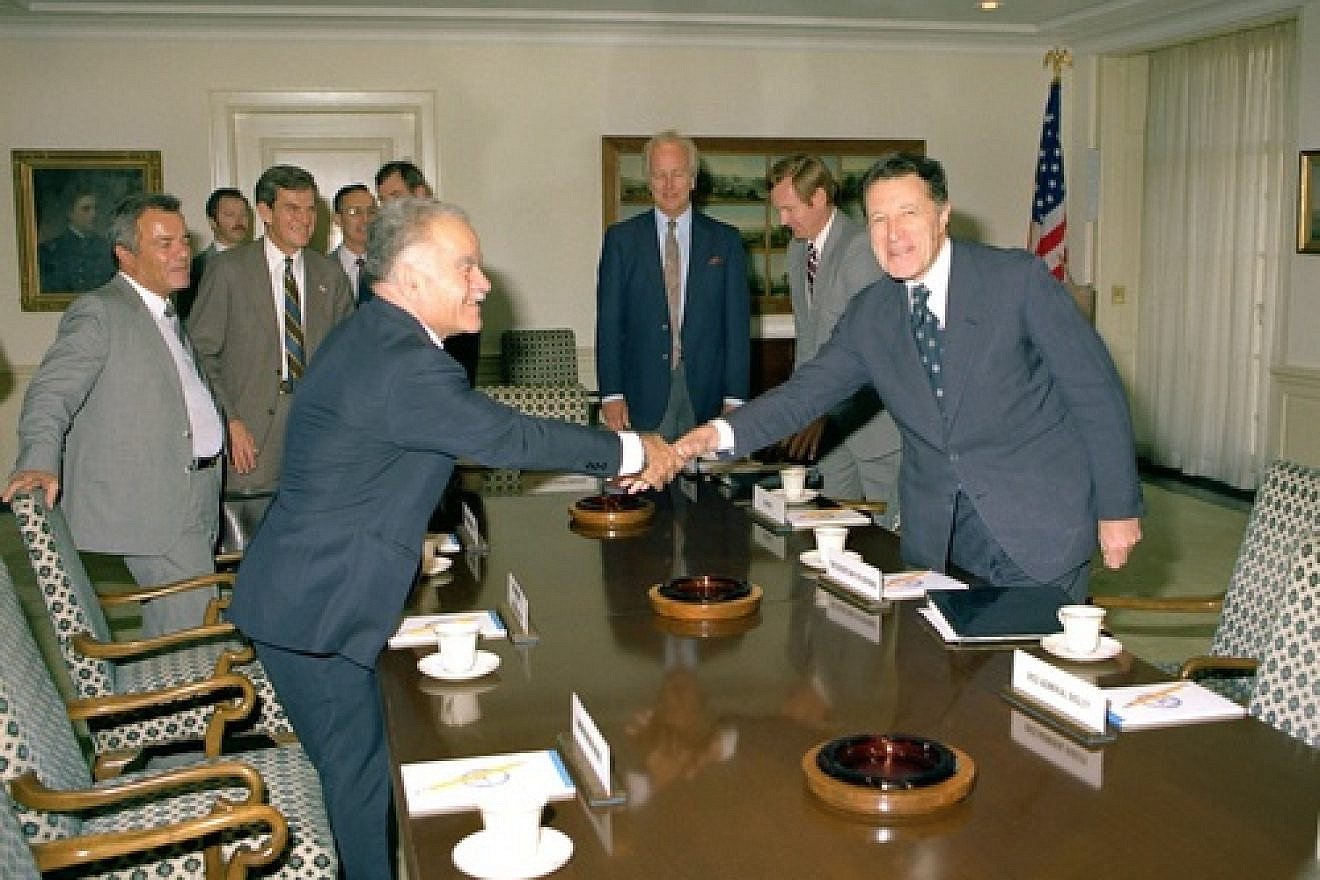 Click photo to download. Caption: U.S. Secretary of Defense Caspar Weinberger (right) greets Israeli Minister of Foreign Affairs Yitzhak Shamir in a Pentagon Conference Room in 1982. In 1983, Shamir rose to prime minister. Credit: Frank Hall.