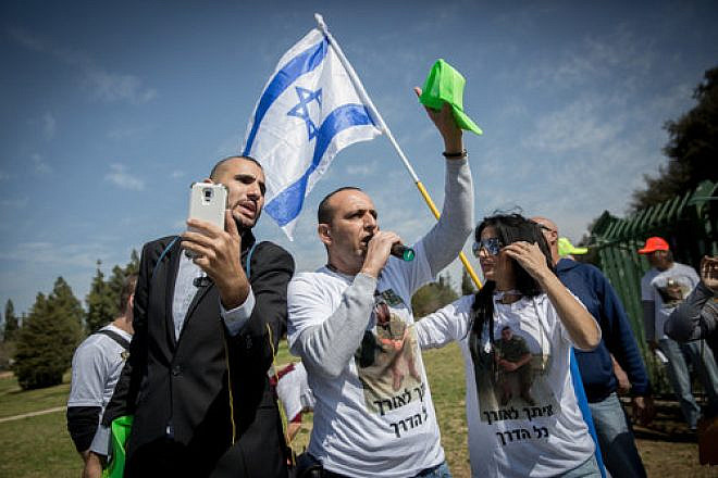 Supporters of Elor Azaria, the Israeli soldier convicted of manslaughter for shooting neutralized Palestinian terrorist Abdel Fattah al-Sharif last year in Hebron, demonstrate outside the Knesset March 15, 2017. Credit: Miriam Alster/Flash90.