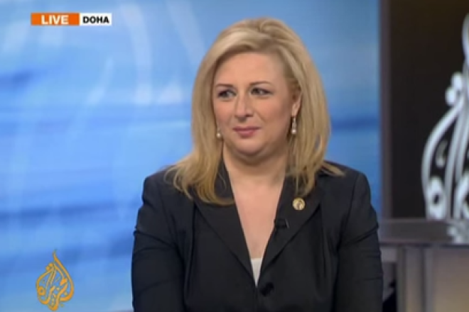 Suha Arafat on the set of Al Jazeera. Screenshot.