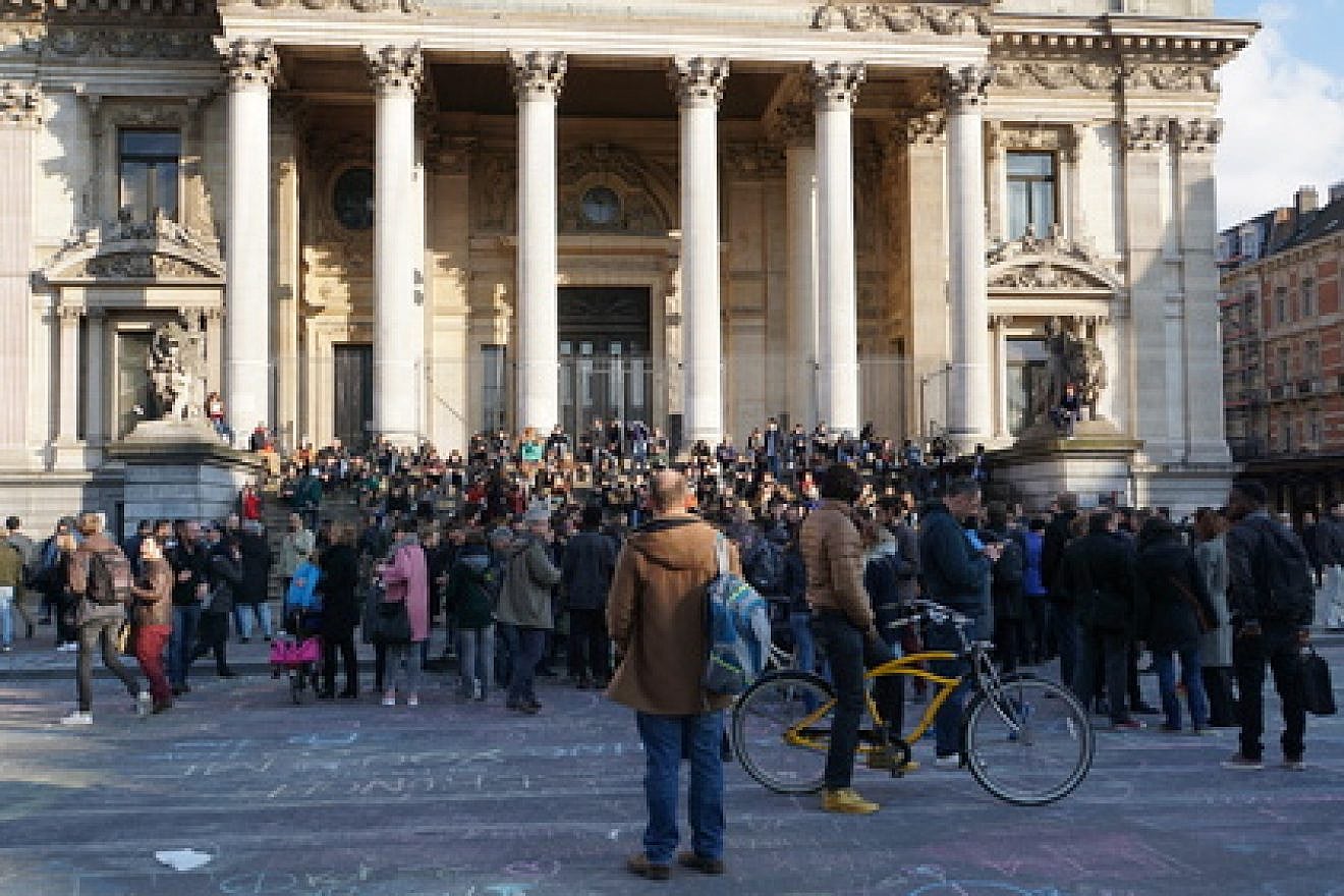 Click photo to download. Caption: A gathering in Brussels on March 22, the day that terror attacks killed 31 people in that city. Credit: Miguel Discart via Wikimedia Commons.