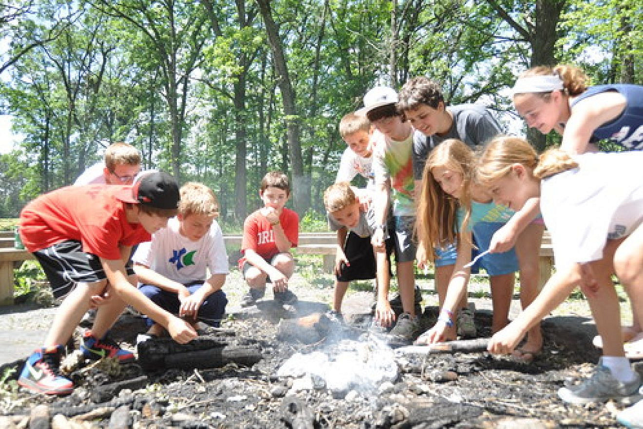 A campfire at Webster, Wisconsin-based Herzl Camp, a JCamp180-supported summer camp. Credit: Herzl Camp.