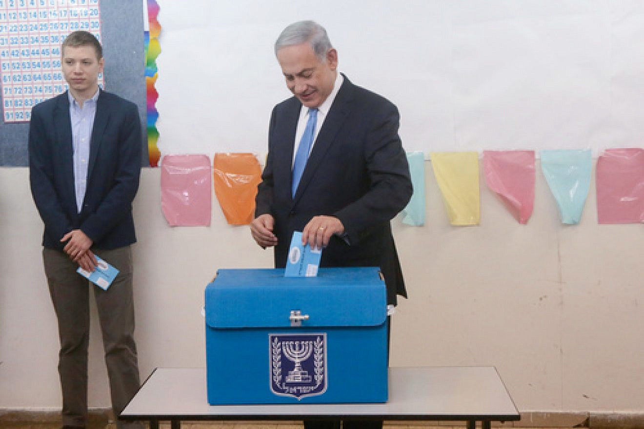 Israeli Prime Minister Benjamin Netanyahu votes in Israel's last election. Credit: Marc Israel Sellem/POOL/Flash90.