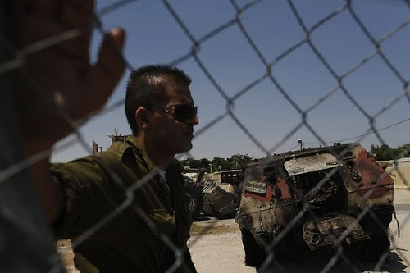 Click photo to download. Caption: The wreckage of an Egyptian military vehicle after terrorists burst it through a security fence into Israel from Egypt, at an Israeli military base along the border with Egypt, southern Israel, Monday, Aug. 6, 2012. Masked gunmen killed scores of Egyptian soldiers Sunday, Aug. 5, 2012, at a checkpoint along the border with Gaza and Israel. Credit: Tsafrir Abayov/Flash90.