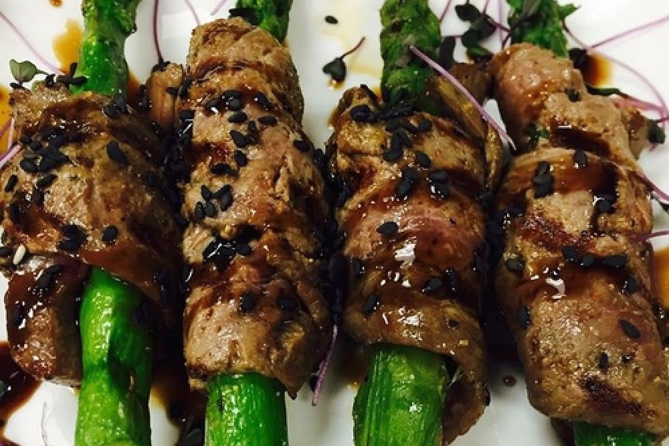 Click photo to download. Caption: One of the appetizers at Houston's 15th Gourmet Kosher Extravaganza, beef-wrapped asparagus by Jason Goldstein of Genesis Steakhouse. Credit: Genesis Steakhouse via Facebook.