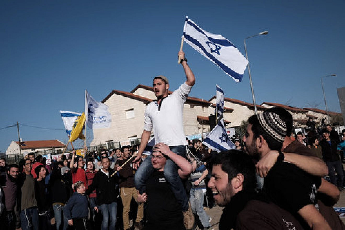A demonstration against the planned demolition of nine homes in the Israeli settlement of Ofra, Feb. 5, 2017. Credit: Tomer Neuberg/Flash90.