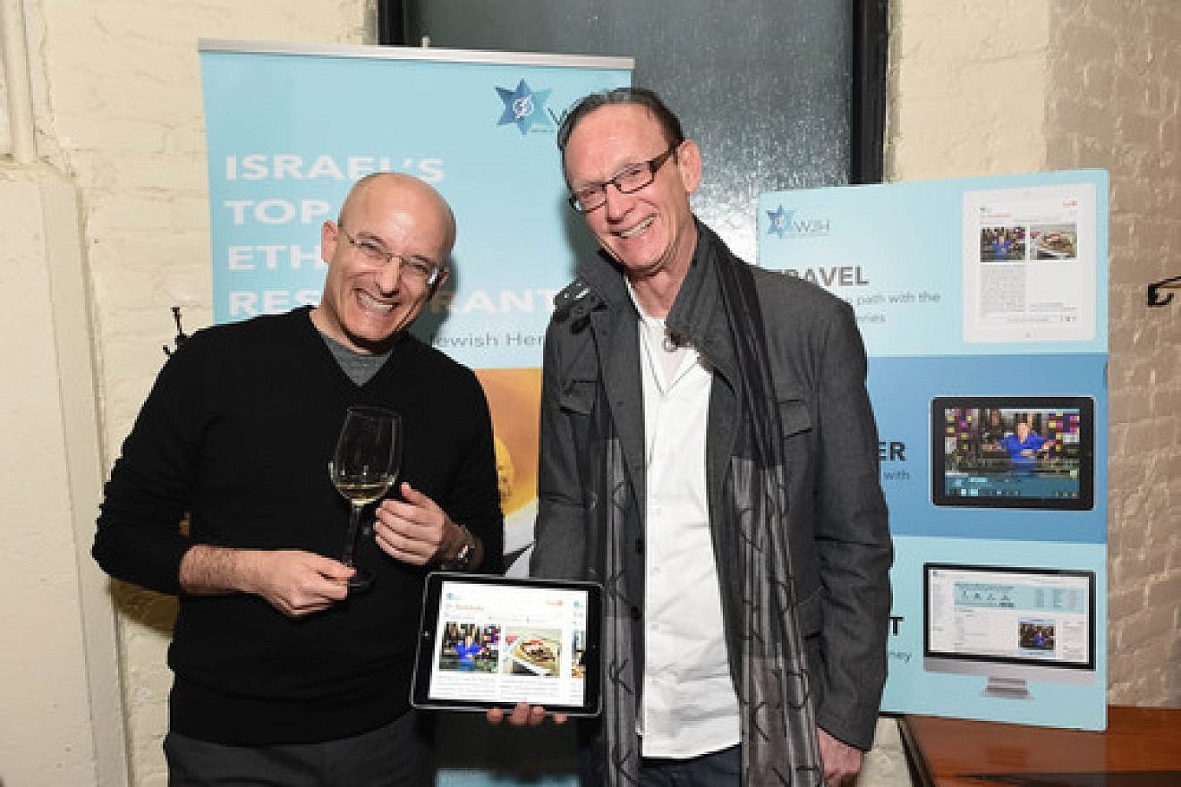 Israeli food critic Gil Hovav (left) and World Jewish Heritage Organization (WJH) founder Jack Gottlieb during the Jan. 14 launch of WJH's eBook, “Israel’s Top 100 Ethnic Restaurants,” at New York City's Balaboosta restaurant. Credit: Shahar Azran.
