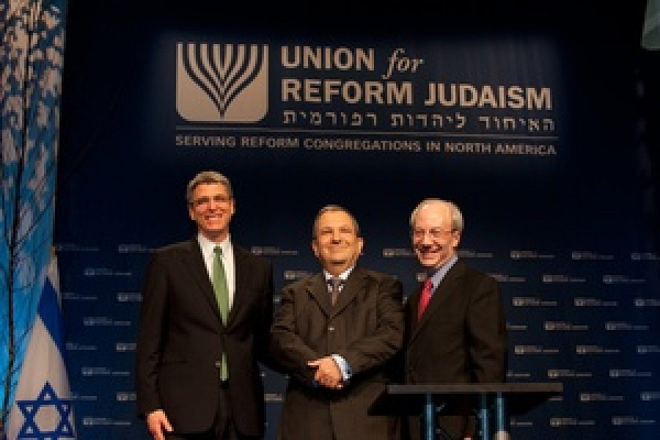 New Union for Reform Judaism President Rabbi Rick Jacobs (far left) and outgoing URJ President Rabbi Eric Yoffie flank former Israeli Prime Minister Ehud Barak at the URJ biennial convention in Washington, D.C. Credit: Courtesy Union for Reform Judaism.