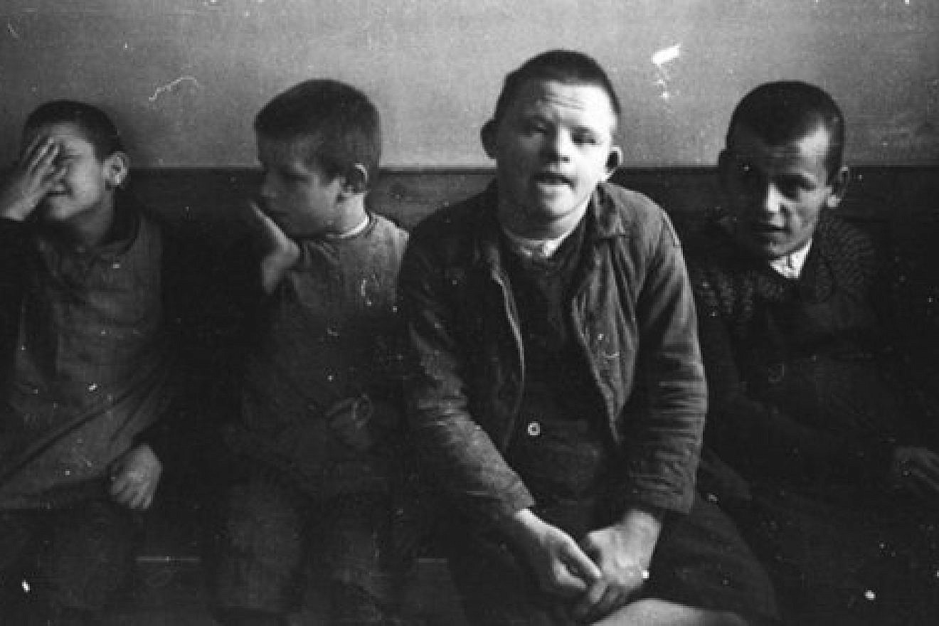 Individuals with disabilities are pictured in 1934, in the run-up to the Holocaust, at Nazi Germany’s Schönbrunn Psychiatric Hospital, in a photo taken by Nazi SS photographer Franz Bauer. In 1941, journalist William Shirer first publicly exposed the Nazis’ systematic execution of people with physical or mental disabilities. Credit: German Federal Archive via Wikimedia Commons.