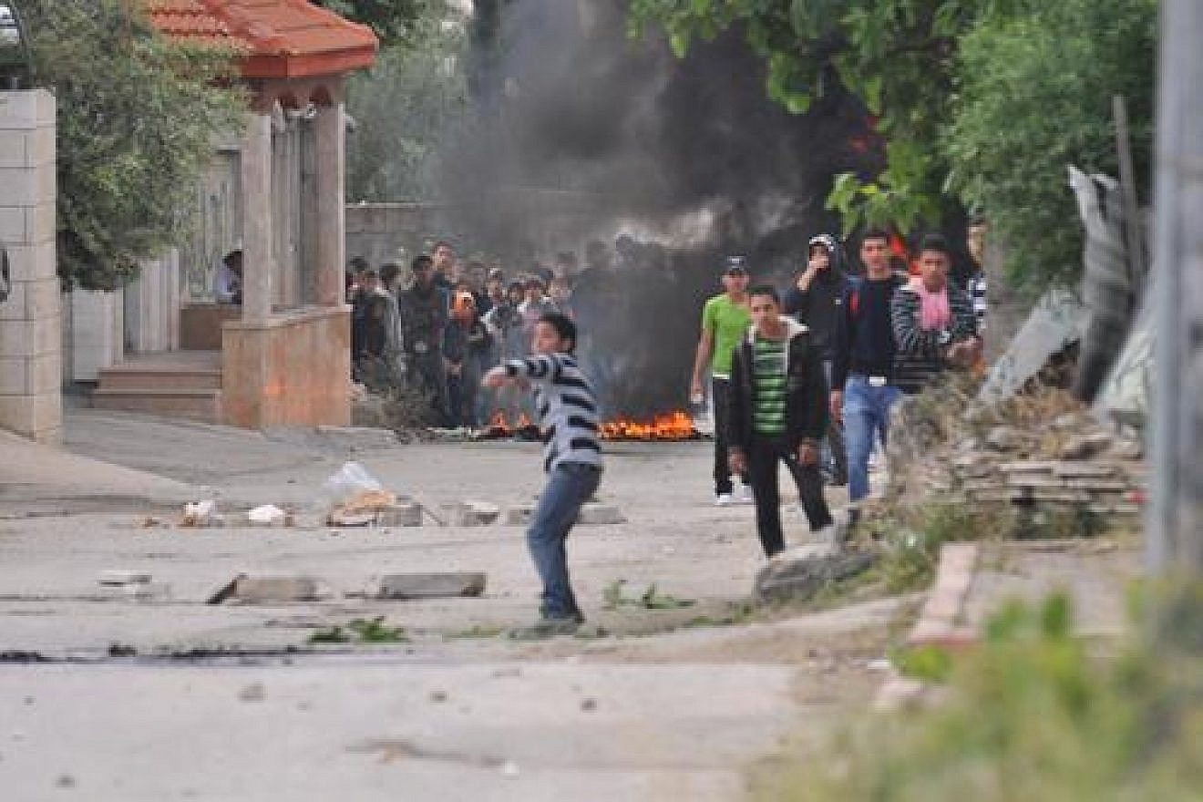 File photo: Palestinian rioters hurl rocks and firebombs at Israeli security forces in El-Arrub, southwest of Bethlehem. Credit: Israel Defense Forces.