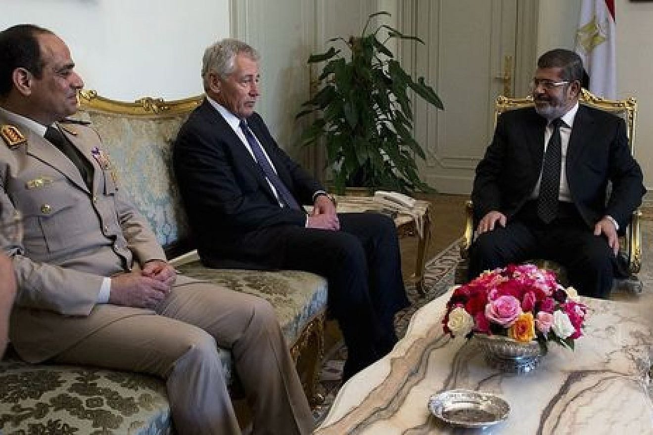 From left to right, former Egyptian defense minister Abdel Fattah El-Sisi, former U.S. defense secretary Chuck Hagel, and former Egyptian president Mohammed Morsi meet in Cairo on April 24, 2013. El-Sisi, who is now Egypt's president, was instrumental in bringing about Morsi's ouster in July 2013. Credit: Erin A. Kirk-Cuomo via Wikimedia Commons.