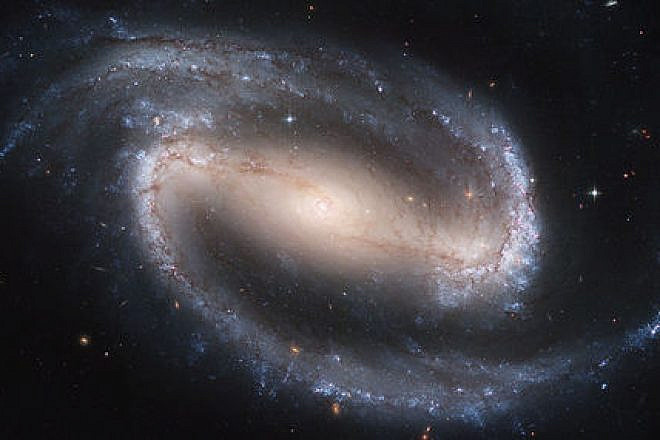 NGC 1300, a spiral galaxy, as photographed by the Hubble telescope. Credit: NASA, ESA, and The Hubble Heritage Team STScI/AURA.