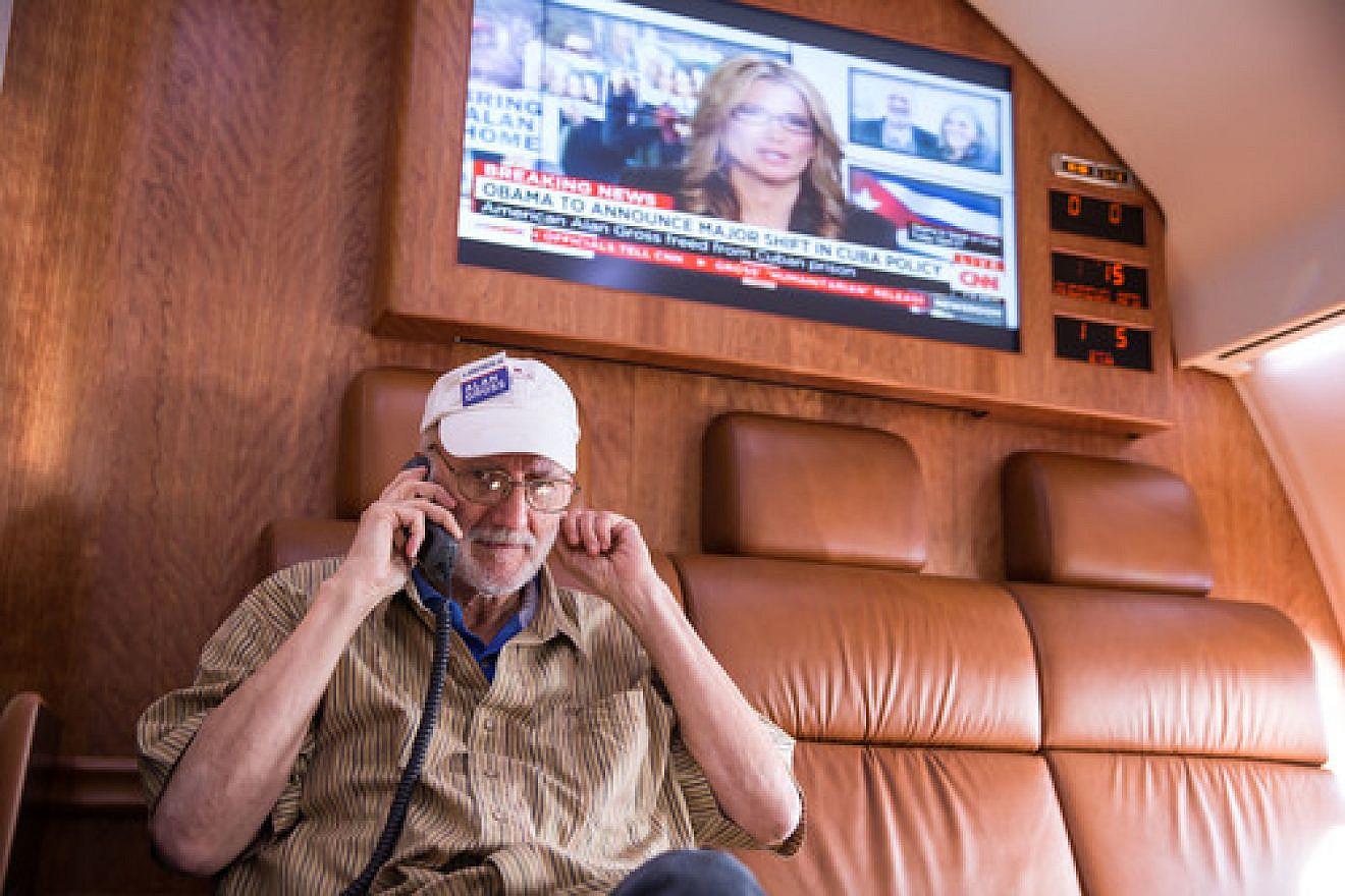 After being released from prison in Cuba, Alan Gross speaks on the phone with President Barack Obama during his flight back to the U.S. on Dec. 17. Credit: White House.