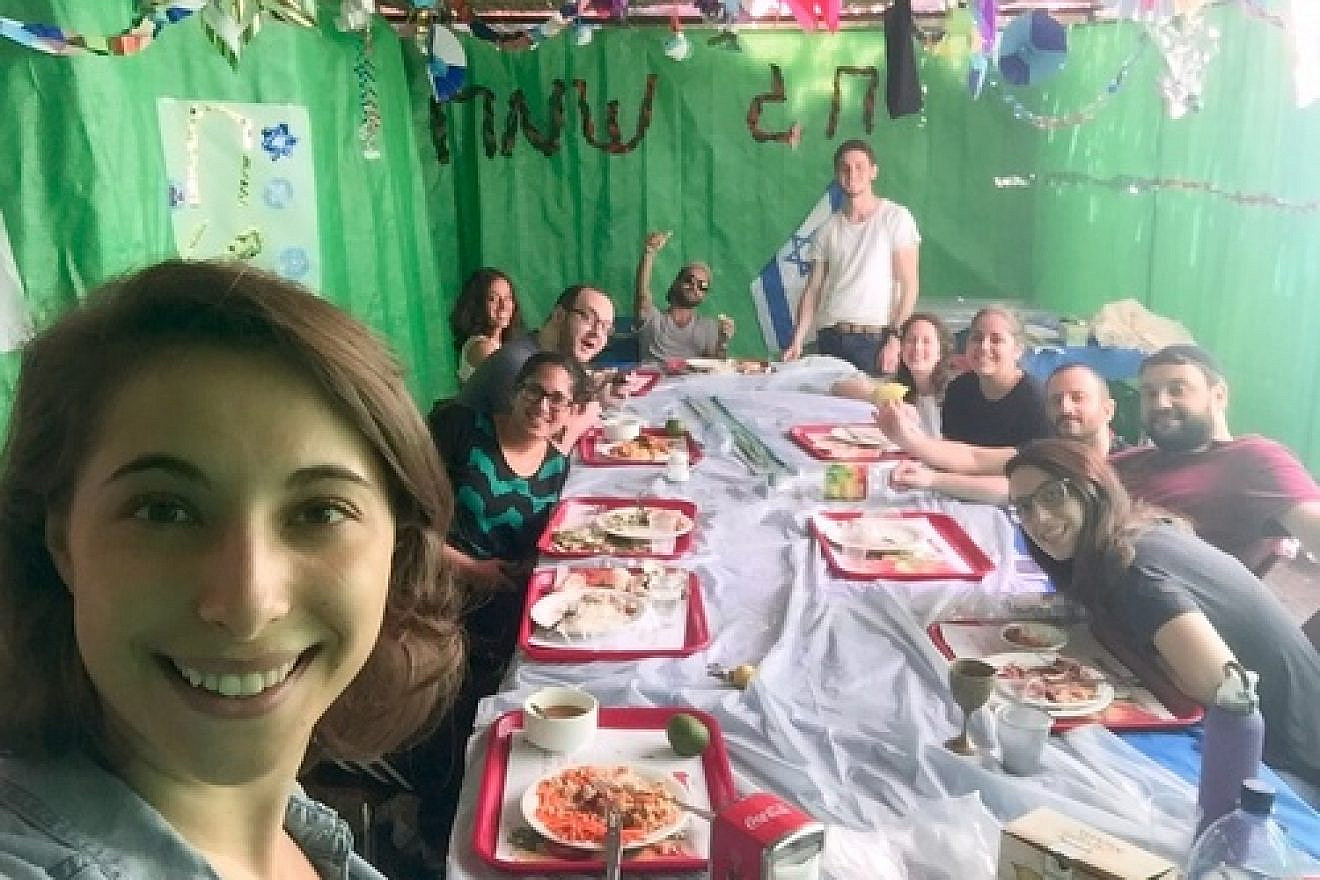 Click photo to download. Caption: Eliana Rudee in the sukkah with her ulpan classmates. Credit: Courtesy Eliana Rudee.