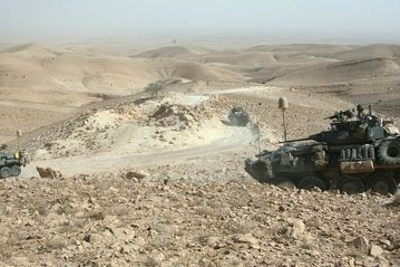 In July 2009, light-armored vehicles with U.S. Marine Corps' Task Force 3rd Light Armored Reconnaissance Battalion, Regimental Combat Team 8, traverse the rocky terrain of the Sinjar Mountains while deployed to the Nineveh province in Iraq. Credit: Sgt. Eric C. Schwartz via Wikimedia Commons.