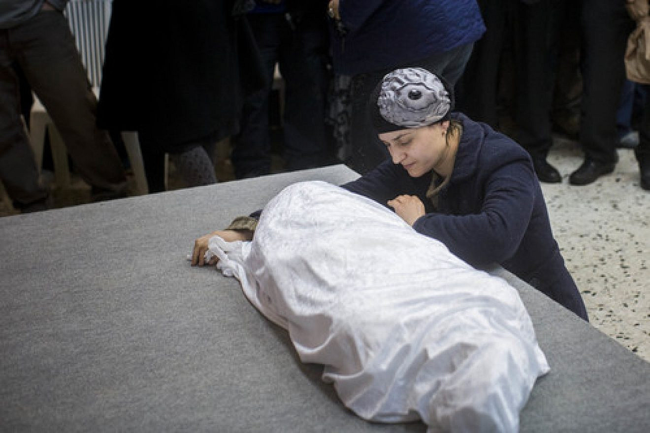 Adva Biton, mother of Adele Biton, a 4-year-old Israeli Jewish victim of a Palestinian stoning attack, cries over her daughter's body in February 2015. Photo by Yonatan Sindel/Flash90.