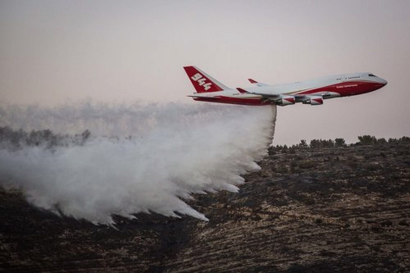 On Nov. 26, the American-dispatched Boeing 747 Supertanker plane helps extinguish a forest fire that broke out in Nataf, near Jerusalem. Credit: Hadas Parush/Flash90.