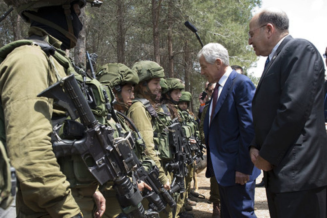 U.S. Secretary of Defense Chuck Hagel and Israeli Minister of Defense Moshe Ya'alon (right) speak with members of the K-9 Special Forces Unit at Camp Adam in Israel on April 23, 2013. Credit: Secretary of Defense.