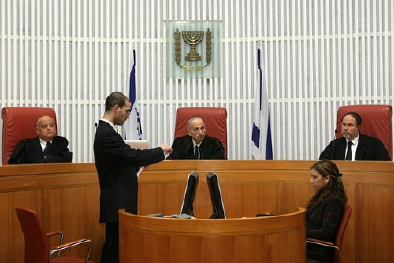 In center is retired Israeli Supreme Court judge Edmond Levy, who is now in the news for heading the Commission to Examine the Status of Building in Judea and Samaria. Credit: Kobi Gideon/Flash90.