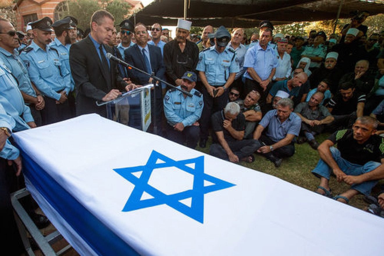 Israel’s Public Security Minister Gilad Erdan speaks at the funeral of Druze police officer Kamil Shnaan in the northern village of Hurfeish, July 14, 2017. Shnaan was one of two Druze police officers killed by Arab terrorists last Friday near the Temple Mount in Jerusalem. Credit: Basel Awidat/Flash90.