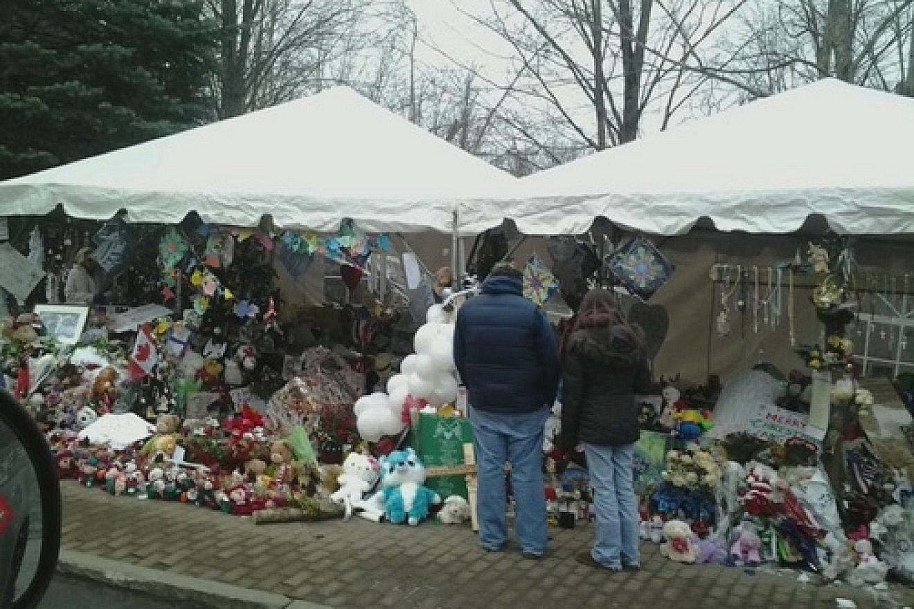 The Sandy Hook Elementary School shooting makeshift memorial on Berkshire Road in Newtown, Conn., 12 days after the December 2012 shooting. The shooting inspired Frank Storch's to create the new school safety tips guide, "Keep Your School Safe," a project he says he undertook "purely for the love of the Jewish people." Credit: Bbjeter via Wikimedia Commons.