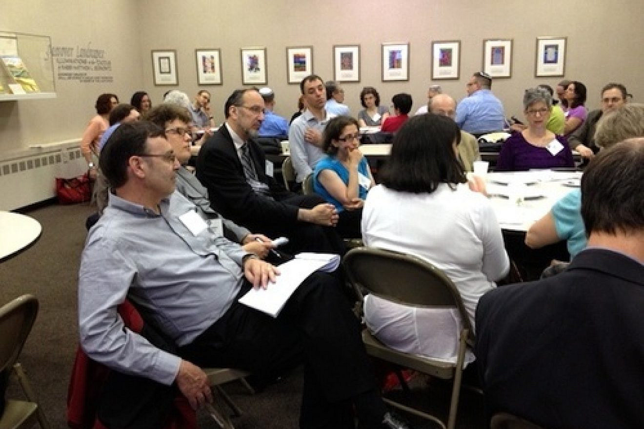 Participants at the Network for Research in Jewish Education conference discuss Consortium for Applied Studies in Jewish Education research agendas around Jewish educational leadership, Israel education and the sustainability of Jewish education, June 3, 2013. Credit: Wendy Rosov.