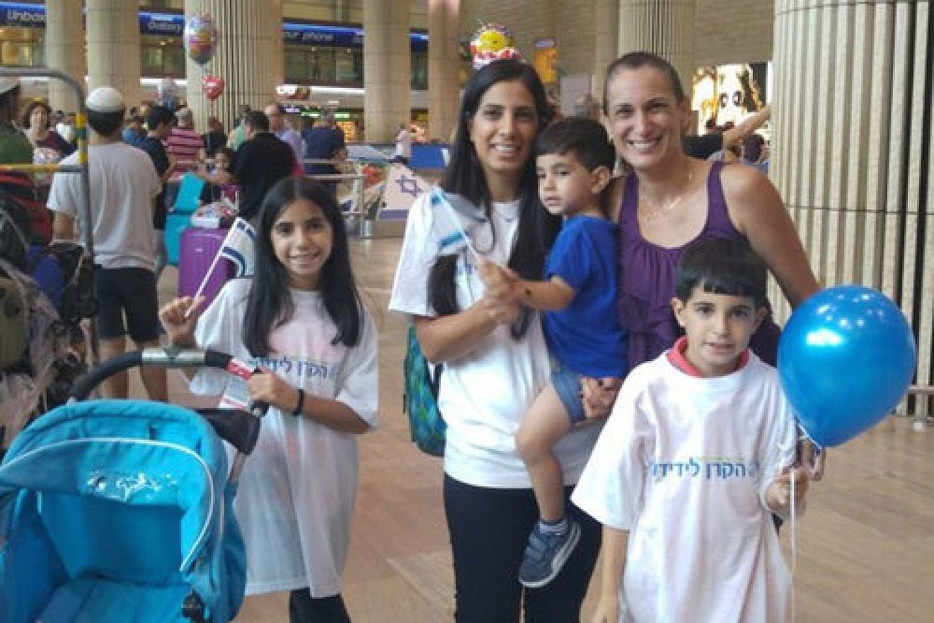Venezuelan Jew Michal Levy and her three children, along with Debbie Ashkenazi (right), coordinator of aliyah from Latin America for the International Fellowship of Christians and Jews, after the Levy family arrived in Israel Wednesday. Credit: International Fellowship of Christians and Jews.
