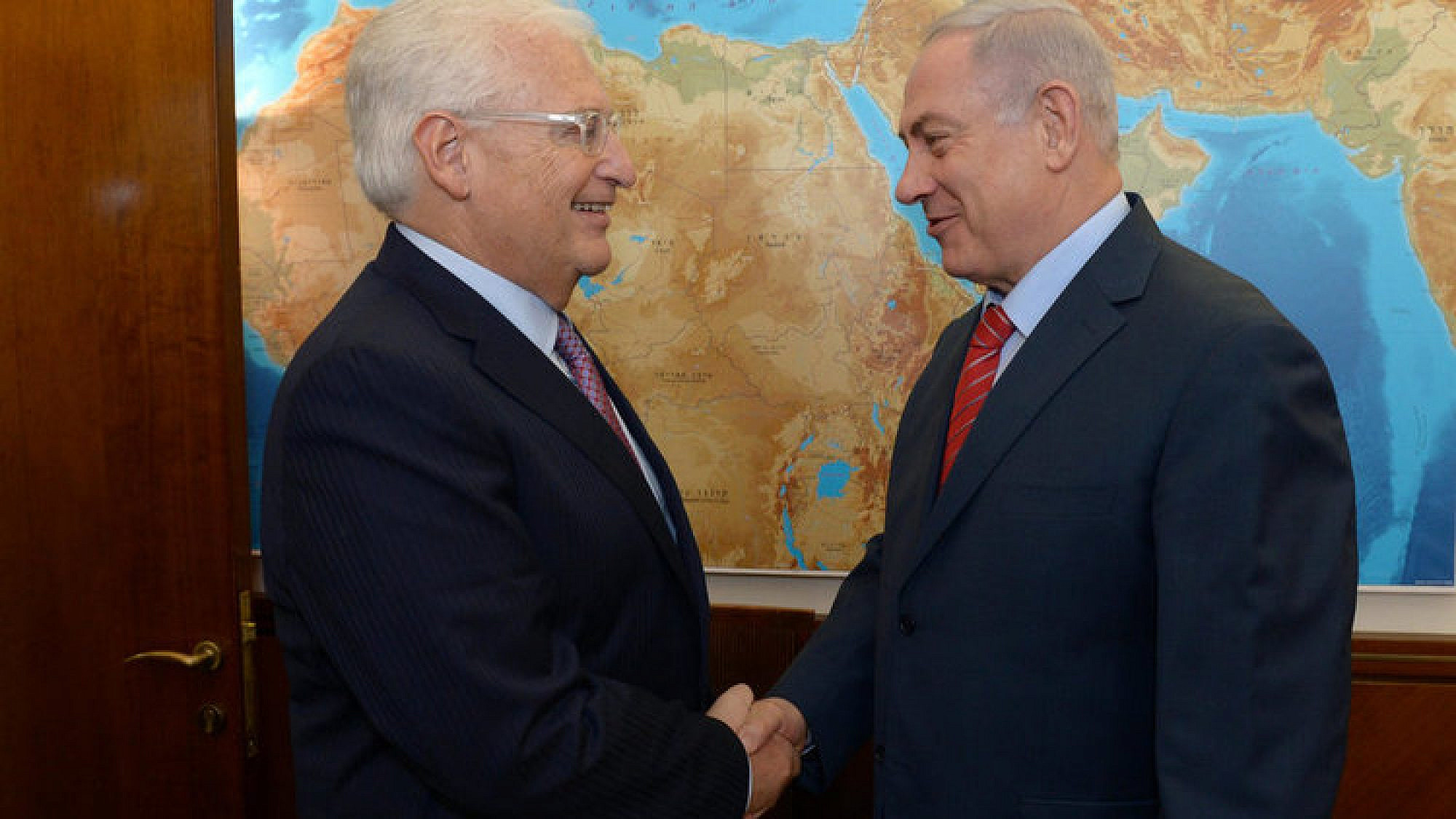 U.S. Ambassador to Israel David Friedman (left) greets Israeli Prime Minister Benjamin Netanyahu. Credit: GPO.