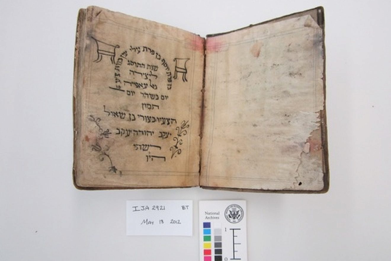 Before treatment by the National Archives and Records Administration, a Passover Haggadah from 1902 recovered from the Mukhabarat, Saddam Hussein’s Intelligence Headquarters. The haggadah is part of what has become known as the Iraqi Jewish Archive. Credit: National Archives and Records Administration.