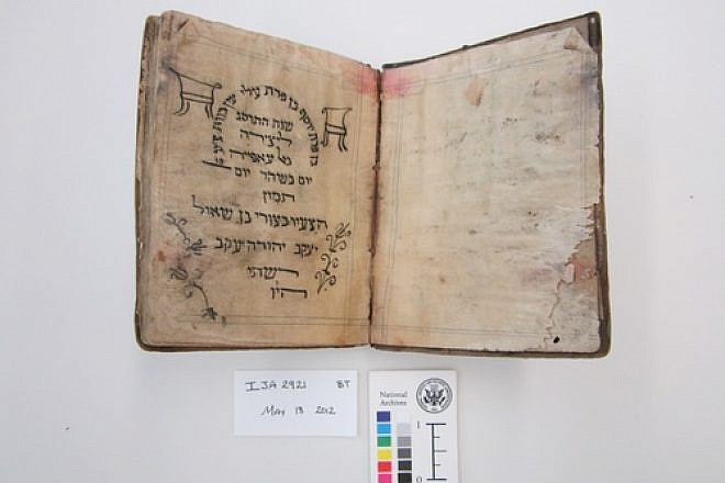 Before treatment by the National Archives and Records Administration, a Passover haggadah from 1902 recovered from the Mukhabarat, Saddam Hussein’s Intelligence Headquarters. The haggadah is part of what has become known as the Iraqi Jewish Archive. Credit: National Archives and Records Administration