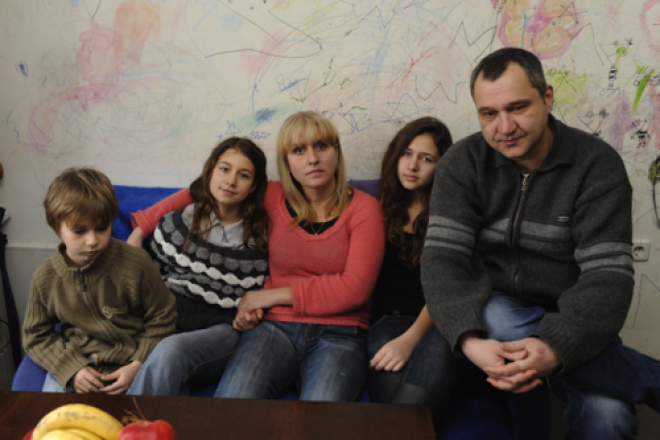 Click photo to download. Caption: With no money to replace the decayed wallpaper in their poorly insulated three-room apartment in Bulgaria, parents Harry and Yana allowed their three children to simply draw on the walls to bring cheer to their home. Economic hardships afflicting Europe pose a dire a threat to Jews, writes Alan H. Gill, CEO of the American Jewish Joint Distribution Committee (JDC). Credit: JDC.