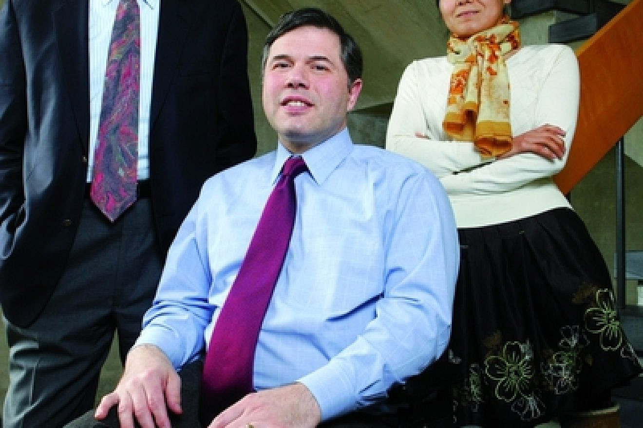 Pictured in center is Dr. Michael Ashley Stein, winner of the inaugural $100,000 Morton E. Ruderman Award in Inclusion. On the left is William P. Alford, who co-founded the Harvard Law School Project on Disability (HPOD) with Stein and is currently the project's chair. On the right is Fenming Cui, director of the China Program at HPOD. Credit: Aynsley Floyd.